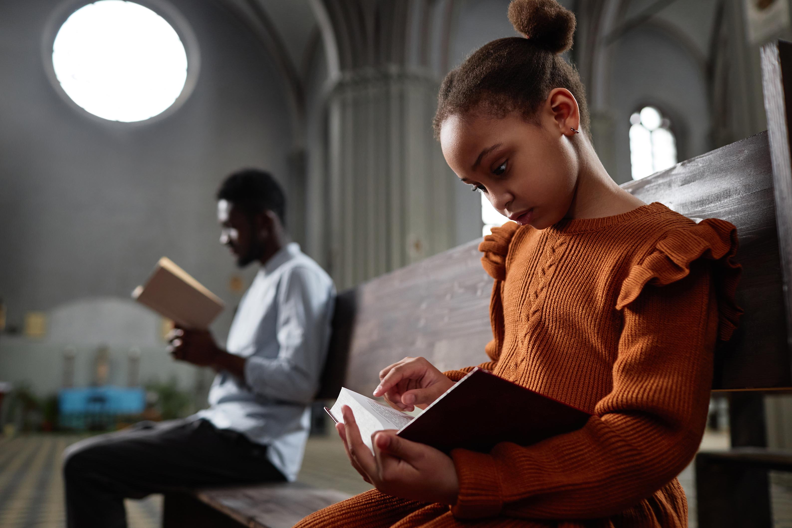 A small group gathered around a table for Bible study and discussion